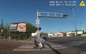 VIDEO: Police Officer Pulls Man in Wheelchair Off of Train Tracks Just in Time