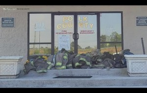 Group of volunteer firefighters walk off job